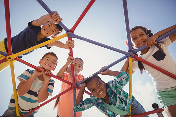 5 kids playing on playground