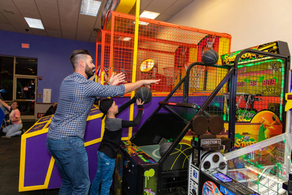 Dad playing pop-a-shot