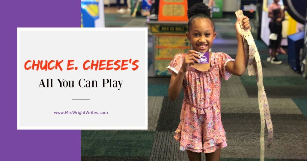 Child holding All You Can Play Pass and Tickets