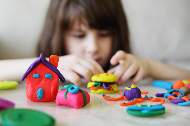 Girl playing with playdough